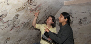 Stephanie Bogin and Madhu Rani assessing condition of wall paintings in the Sheesh Mahal. © Courtauld Institute of Art