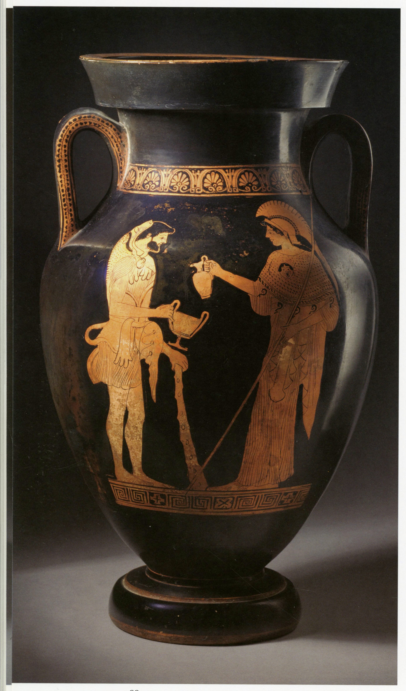 Red-figure ancient Greek vase showing a helmeted Athena pouring wine into a cup for Herakles, who stands with a double-handled cup outstretched