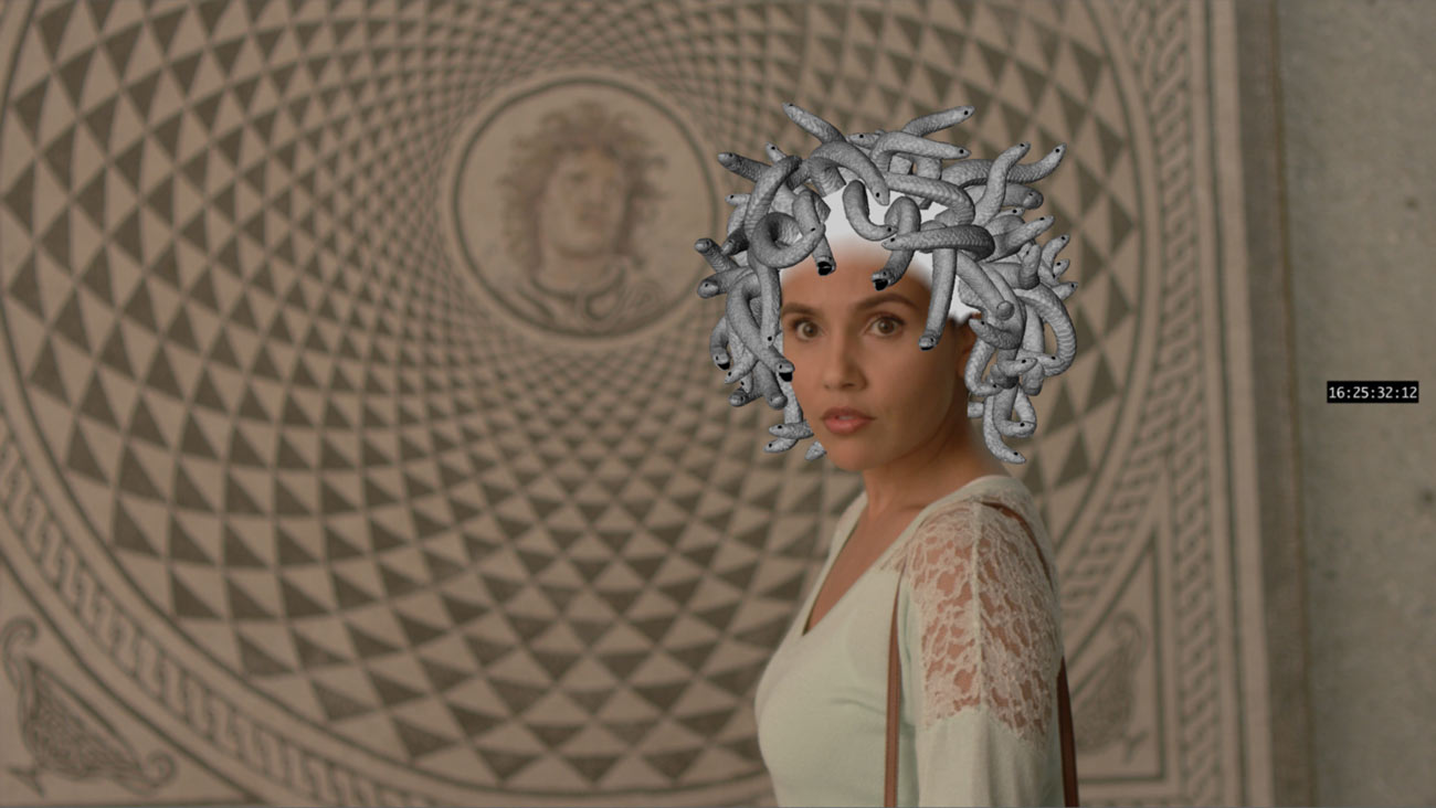 The snakes are now silver and entwined with each other.