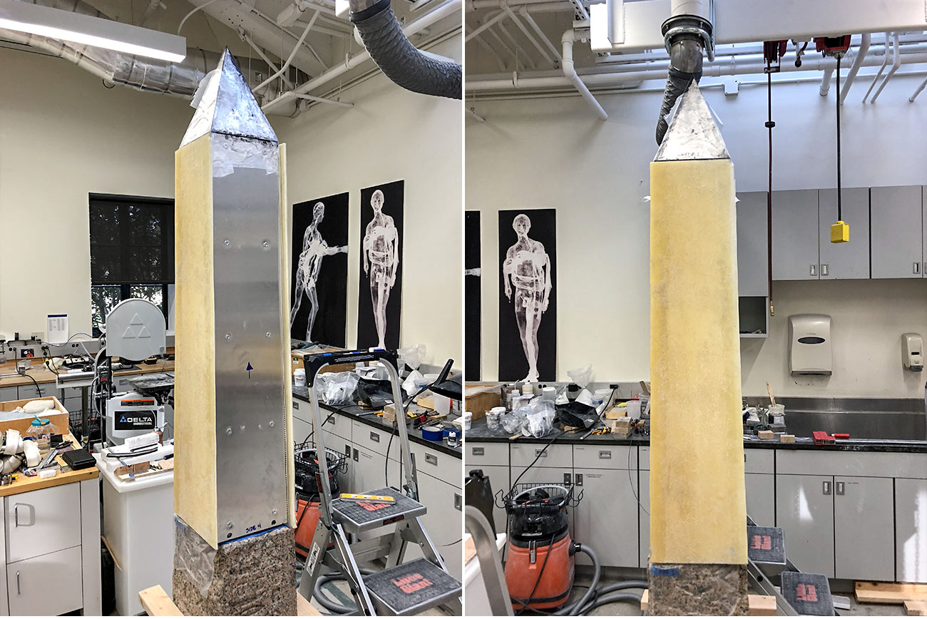 Two more views of the assembled obelisk showing metal panels with wooden panels attached outside.