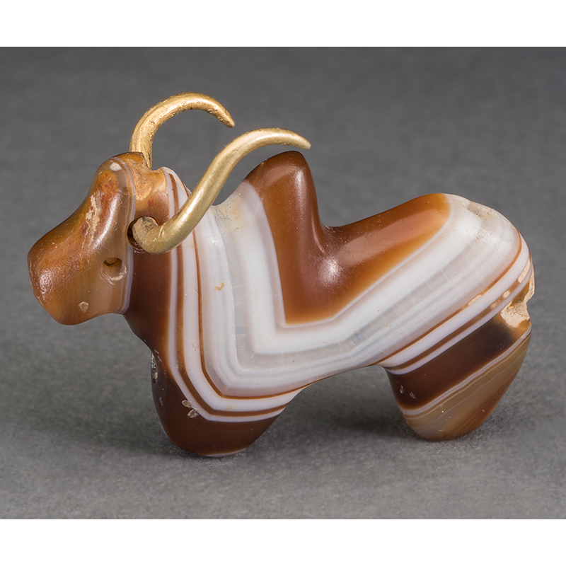 Humped bull with gold horns, Harappan period, about 1800 BC, Pur village, Bhiwani Khera, Haryana, India. Banded agate and gold, Height: 3.5 cm, Width: 1.7 cm, Depth: 1.305 cm. Directorate of Archaeology and Museums, Haryana, Government of Haryana, 5/12B-238 Humped bull with gold horns, Harappan period, about 1800 BC, Pur village, Bhiwani Khera, Haryana, India. Banded agate and gold, Height: 3.5 cm, Width: 1.7 cm, Depth: 1.305 cm. Directorate of Archaeology and Museums, Haryana, Government of Haryana, 5/12B-238
