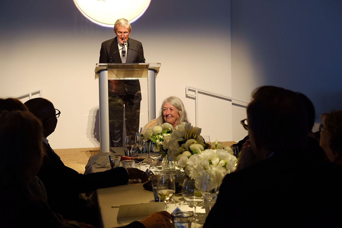 Mary Beard laughs as Neil MacGregor humorously describes her