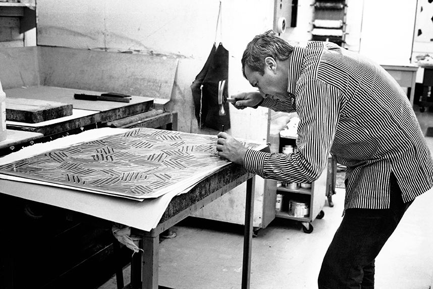 Jasper Johns working on an embossing plate for Four Panels from Untitled.  Photograph © 1974 Sidney B. Felsen