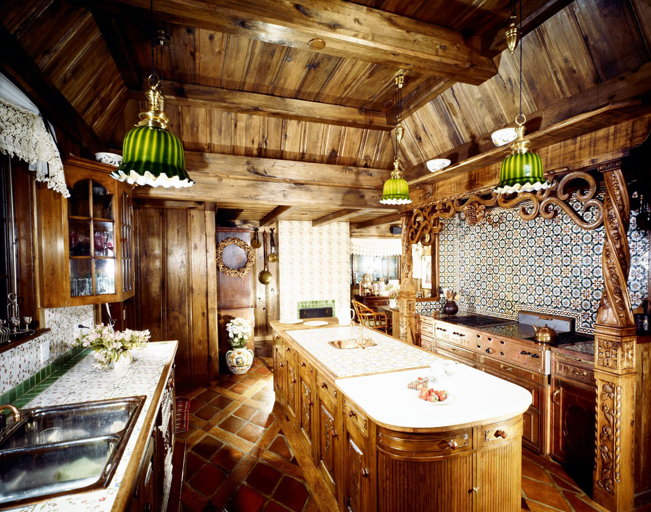 Kitchen with wood paneled walls and ceiling.