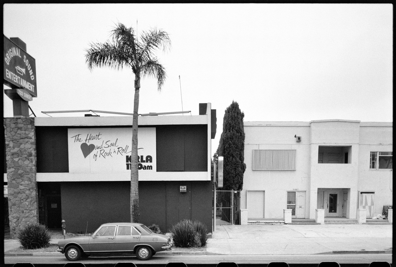 Two-story building painted black with white trim, with a sign on the front that says The Heart and Sould of Rock and Roll