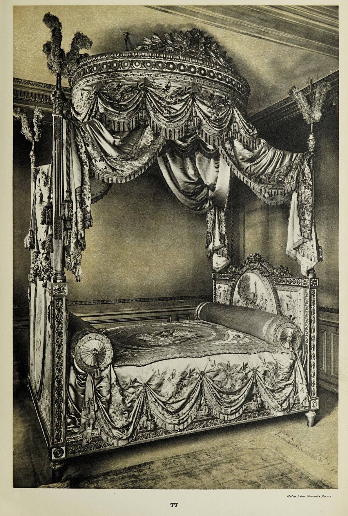 Old black and white photo of a canopy bed, with draped fabric forming the canopy and adorning the bed