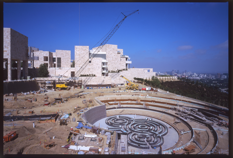 View of the Central Garden under construction in 1997 Color photo of Getty Central Garden under construction, so the ground is brown dirt and the museum sits in the background