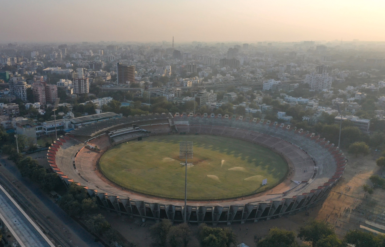 Overhead view of sports stadium in the middle of dense city