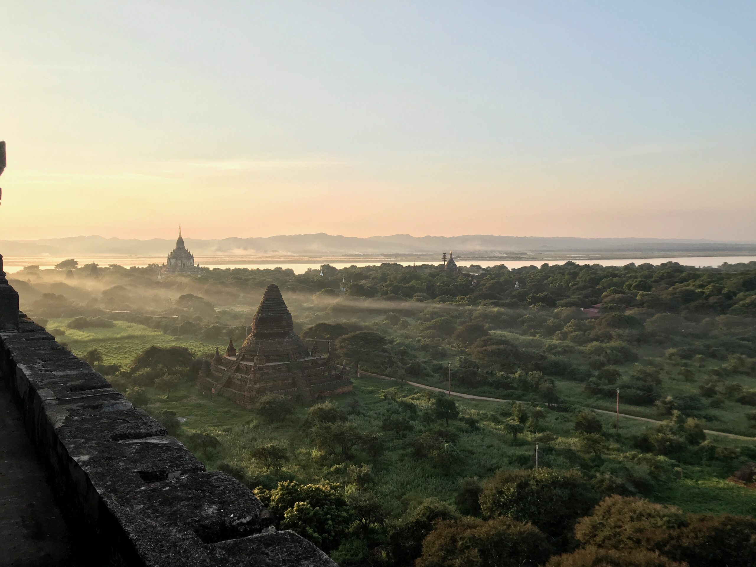 Situated on a bend in the Ayeyarwady (Irrawaddy) river, Bagan is a vast cultural landscape of over 3,500 religious structures and archeological remains. It is a ‘living site’ that is also home to some 40 villages and host to thousands of pilgrims who visit each year to worship and continue the Buddhist practice of merit making. Photo: Susan Macdonald Sunset over landscape of Bagan, Myanmar with multiple temples in the distance