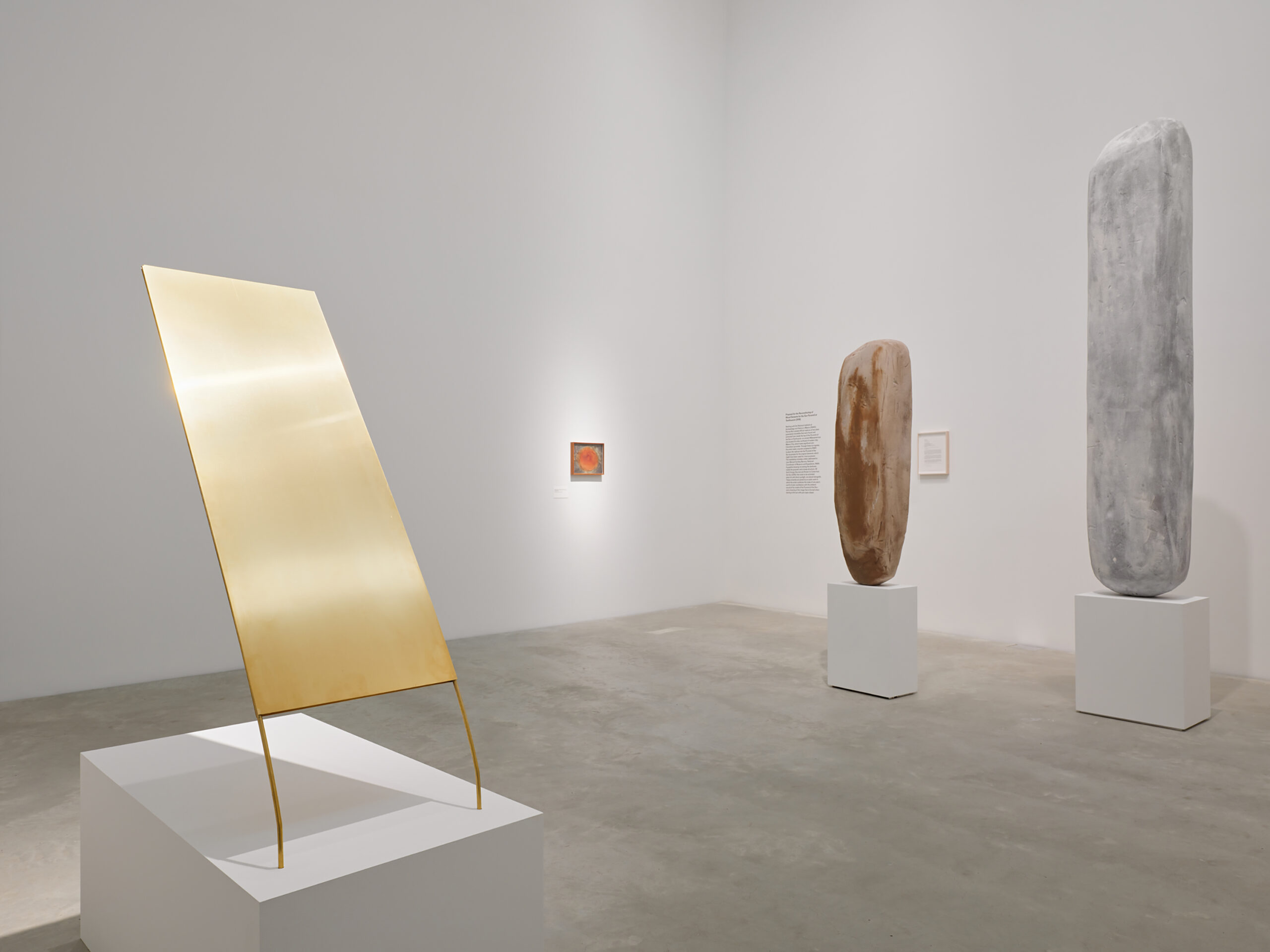 Proposal for the Reconstituting of Ritual Elements of the Sun Pyramid at Teotihuacan, 2019. Courtesy of the artist and Commonwealth and Council, Los Angeles and LABOR, Mexico City. Photo: Shark Senesac A computer-designed image of sculptures arrayed in a room. One is gold, two others are stone plinths.