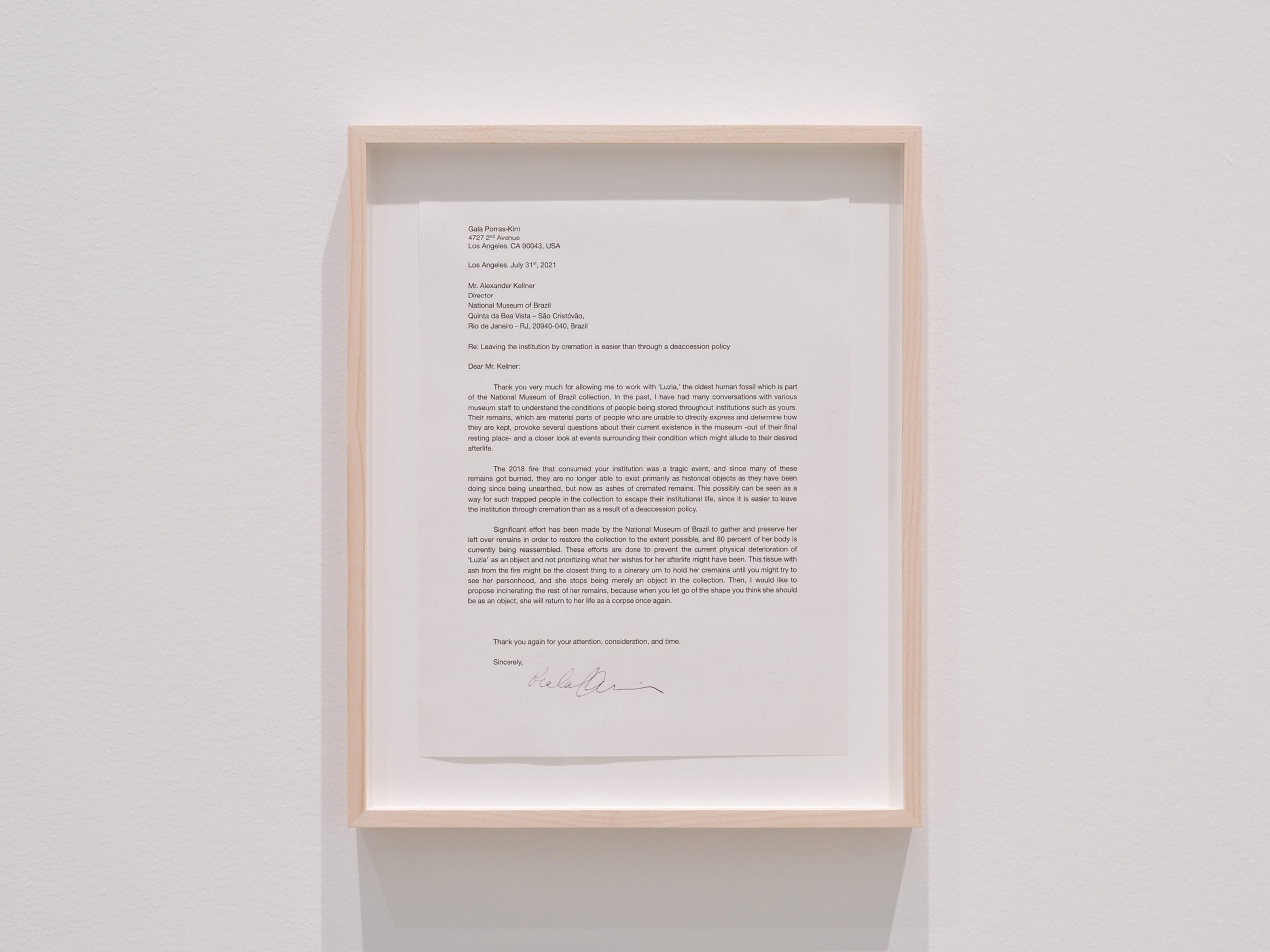 Leaving the institution through cremation is easier than as a result of a deaccession policy, 2021. Napkin, ash, document. Courtesy of the artist and Commonwealth and Council, Los Angeles and LABOR, Mexico City. Photo: Shark Senesac A framed letter hung on a wall