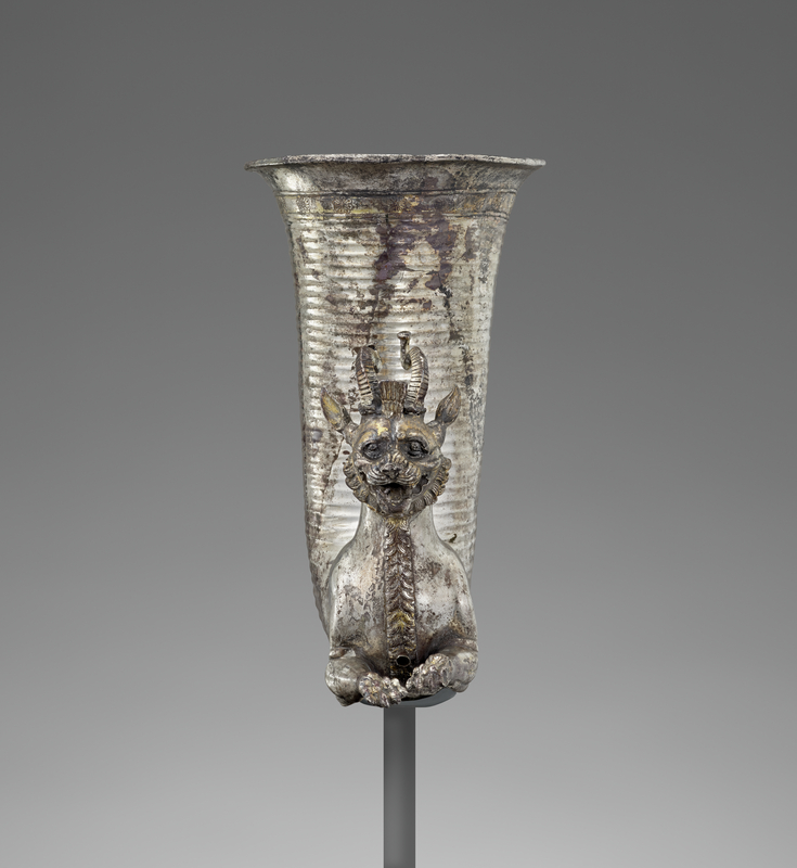 Drinking Horn (Rhyton) with a Lion-Griffin, 5th century B.C., Achaemenid. Silver, 6 3/4 × 7 1/2 × 4 in. The Wyvern Collection Animal headed drinking horn made in silver